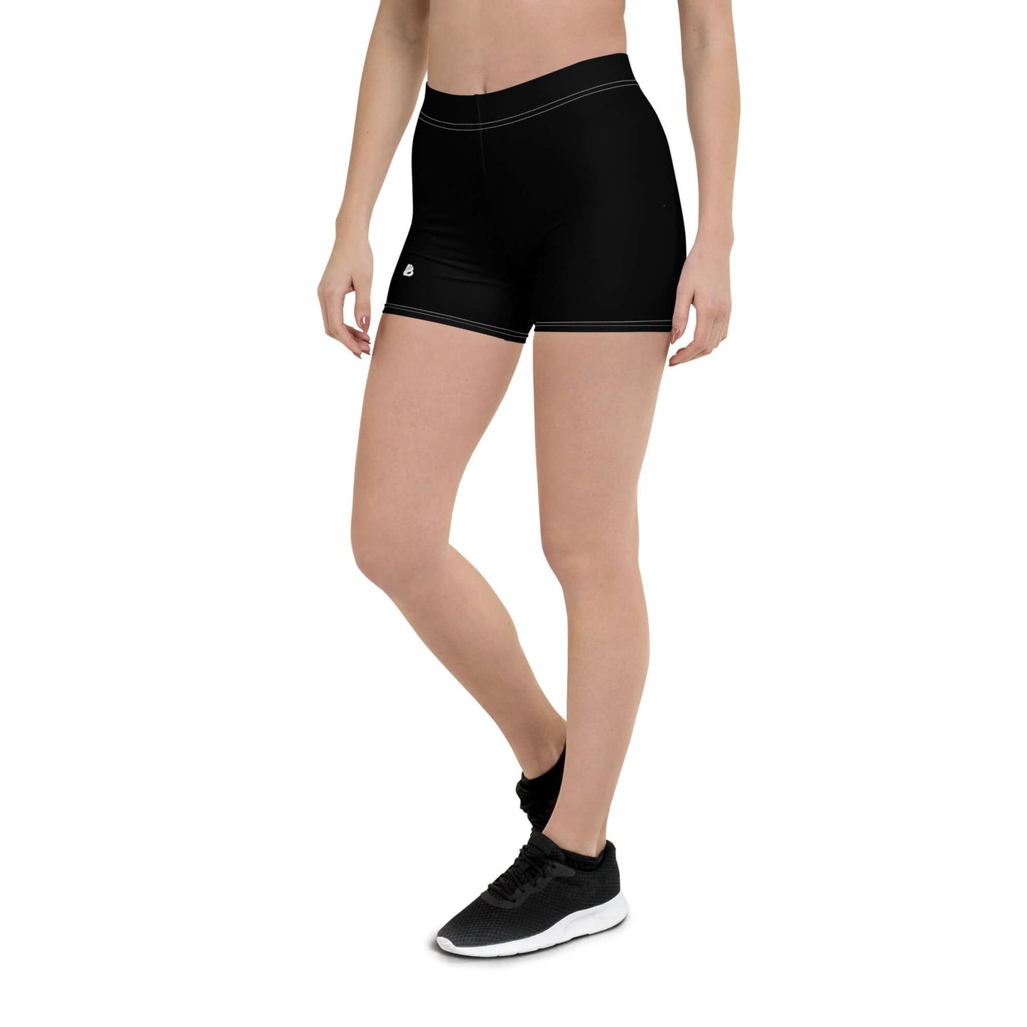 Woman wearing black fitted Shorts N°1 with four-way stretch fabric for comfortable movement.