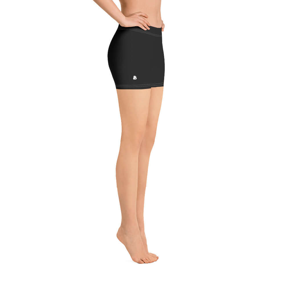 Side view of Shorts N°1 in black, featuring four-way stretch fabric made from smooth microfiber for comfort and flexibility.