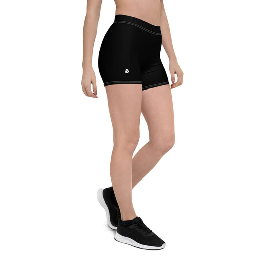 Black athletic Shorts N°1 with four-way stretch and microfiber yarn, worn by model for active activities, providing comfort and energy boost.