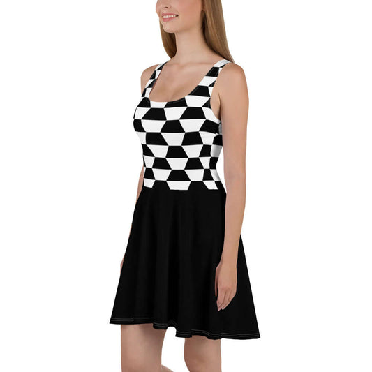 Woman wearing Skater-Kleid N°4, sleeveless with geometric pattern and flared skirt, standing sideways.