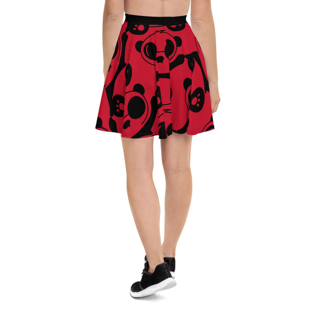 Back view of Skater-Rock N°0 featuring soft fabric and flared design in red with black patterns, mid-thigh length, elastic waistband.