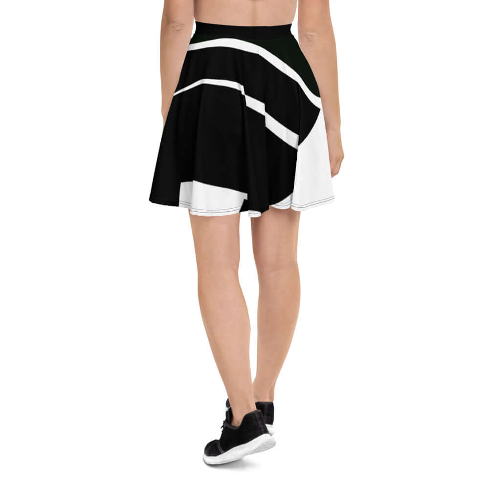 Woman wearing Skater-Rock N°5 showing A-line design in black and white with elastic waistband for comfort