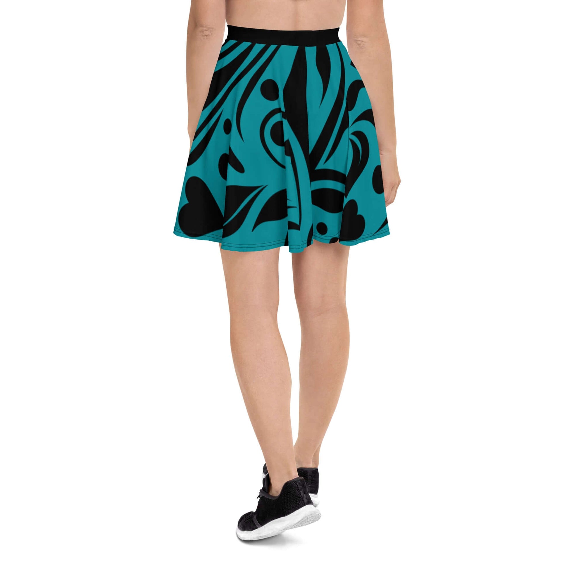 Back view of Skater-Rock N°8, featuring a teal and black abstract design, flattering silhouette, and elastic waistband for comfort.