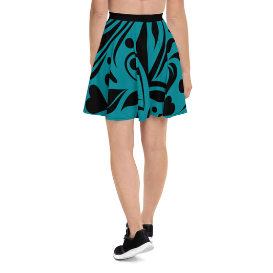 Back view of Skater-Rock N°8, featuring a teal and black abstract design, flattering silhouette, and elastic waistband for comfort.
