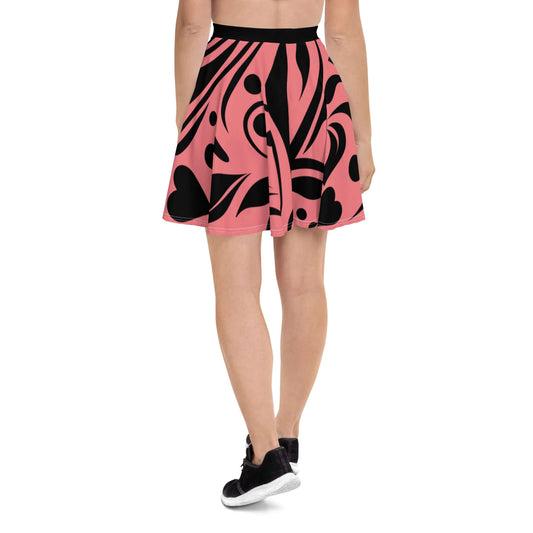 Woman wearing Skater-Rock N°9 in pink and black pattern, showcasing soft fabric and flattering silhouette with elastic waistband.