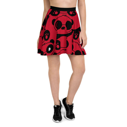 Model wearing Skater-Rock N°0, red skater skirt with black graphic design, elastic waistband, mid-thigh length, flattering silhouette.
