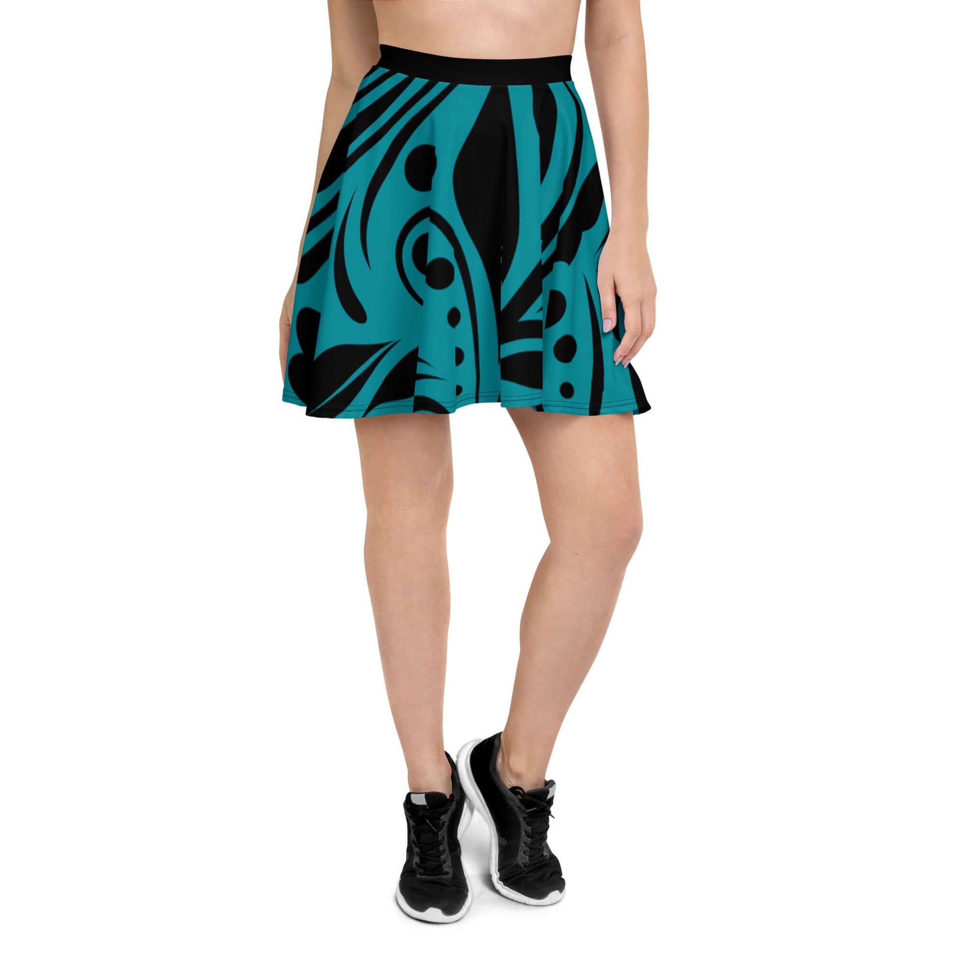 Woman wearing Skater-Rock N°8 with a blue and black abstract design, featuring a flattering silhouette and elastic waistband for comfort.
