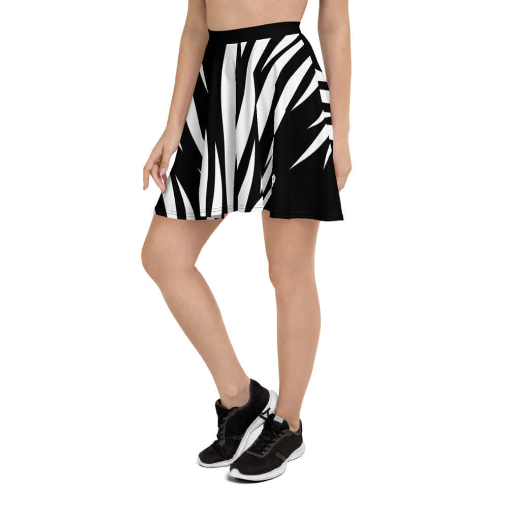 Woman wearing Skater-Rock N°2 with black and white pattern, featuring a flattering silhouette and elastic waistband, mid-thigh length.