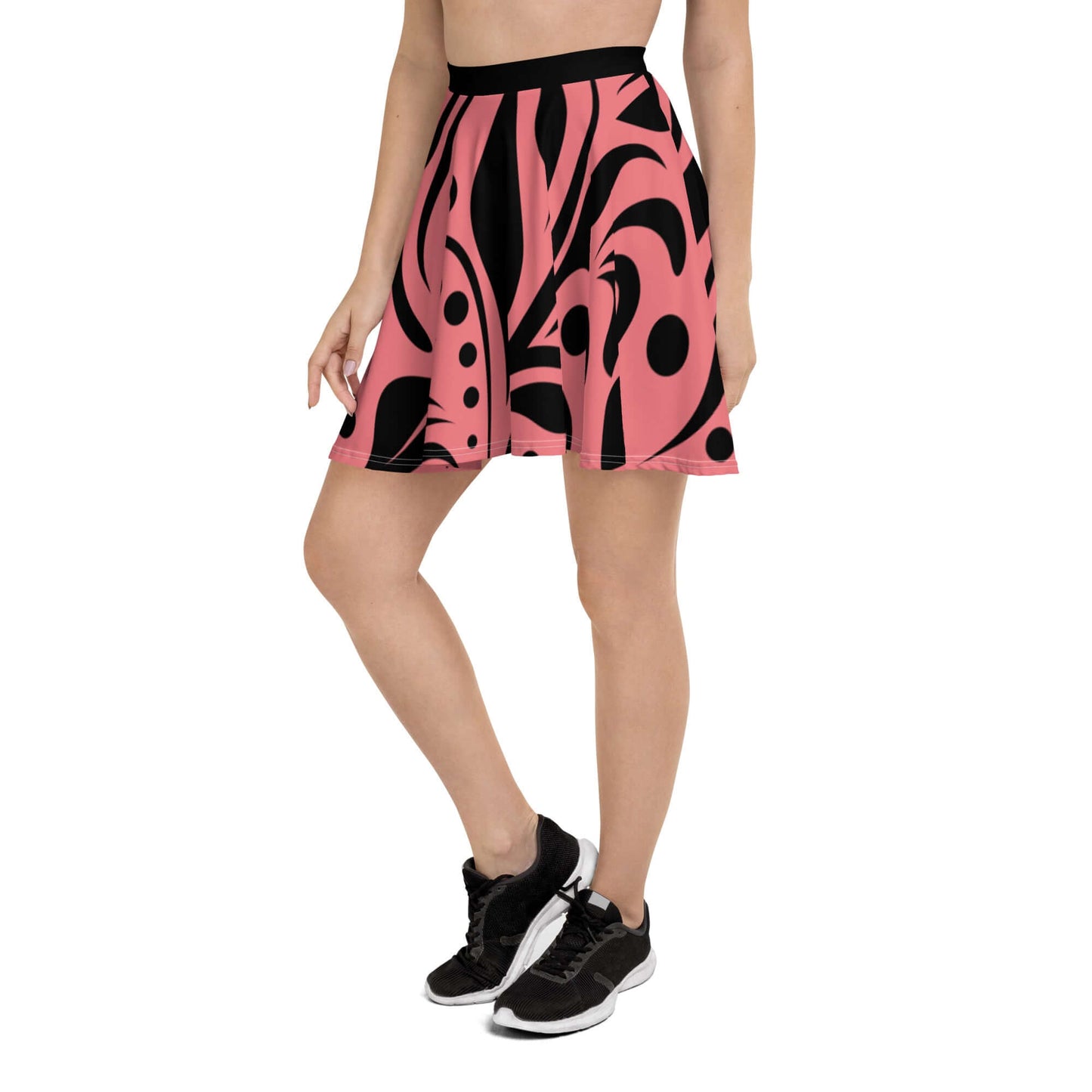 Model wearing Skater-Rock N°9 with pink and black abstract design, soft fabric, and flattering fit, perfect for all body types.