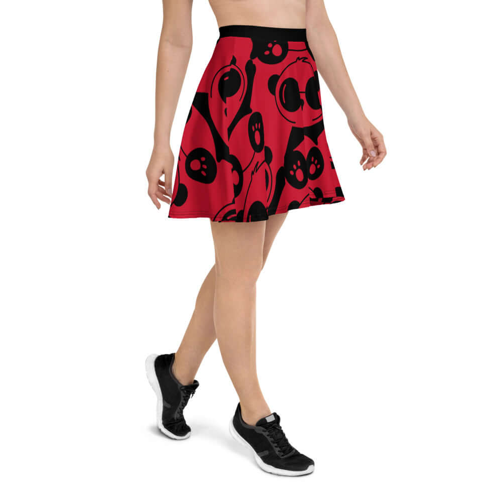 Model wearing Skater-Rock N°0 in red and black, featuring a flared silhouette and comfortable elastic waistband.