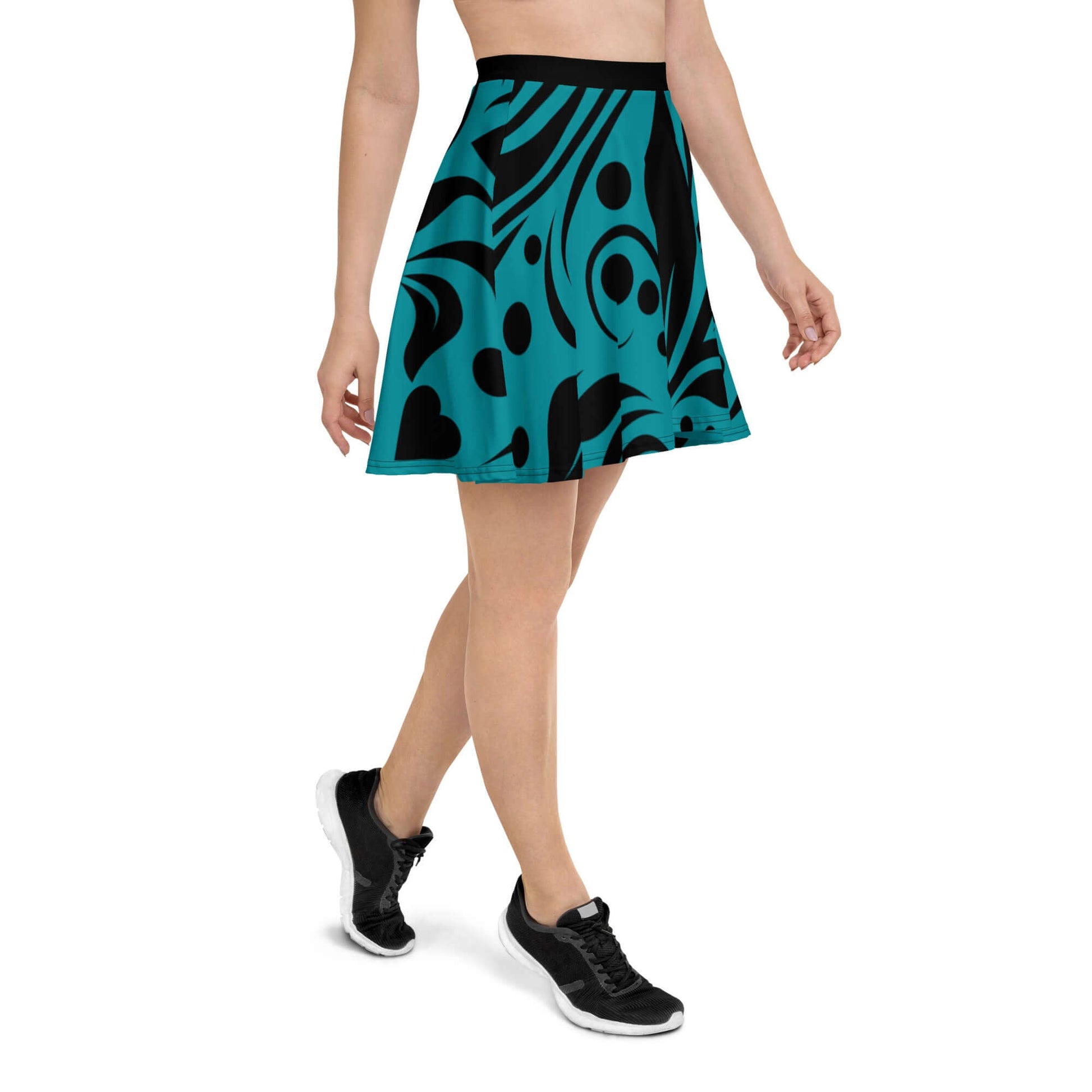 Woman wearing Skater-Rock N°8 with abstract black and blue pattern, showcasing a flattering silhouette and comfortable elastic waistband.