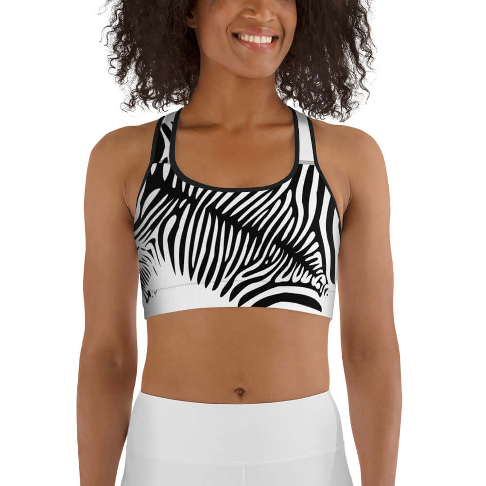 Woman wearing Sport-BH N°0 in zebra print design for lightweight to medium training.