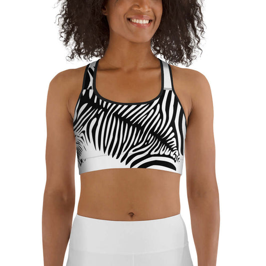Woman wearing Sport-BH N°0 in zebra print design for lightweight to medium training.