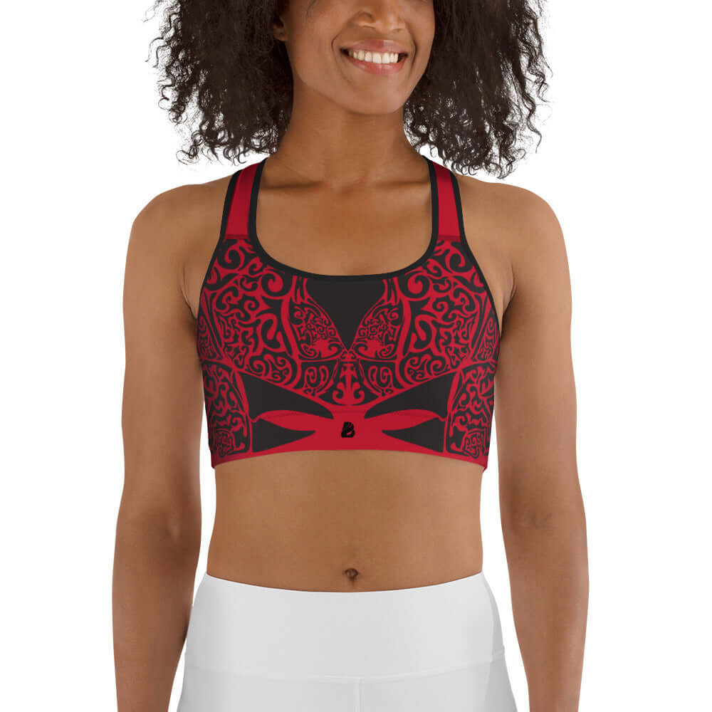 Sport-BH N°2 in red with black patterns, designed for medium intensity workouts, featuring supportive shoulder straps and wide elastic band.