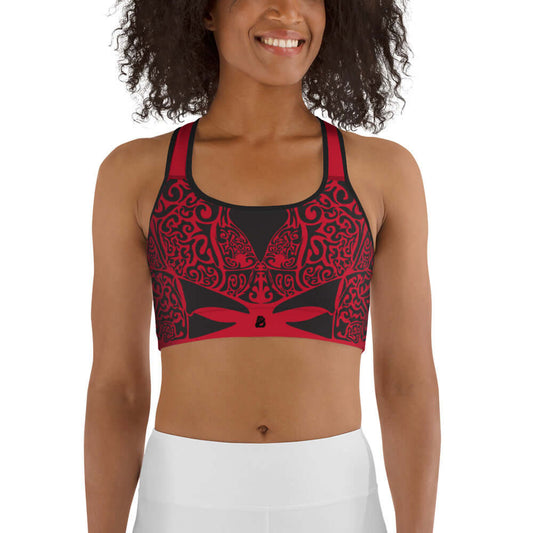 Sport-BH N°2 in red with black patterns, designed for medium intensity workouts, featuring supportive shoulder straps and wide elastic band.