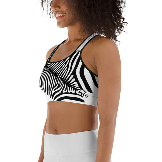 Woman wearing Sport-BH N°0 with zebra print, designed for moisture absorption and medium support.