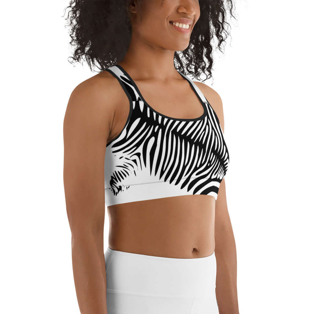 Woman wearing Sport-BH N°0 with zebra print design and supportive features, ideal for light to medium exercise.