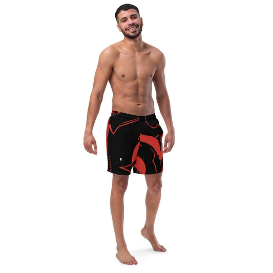 Man wearing Herren-Badehosen N°4 with red and black design, featuring quick-drying and breathable fabric.