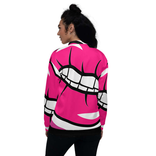 Woman wearing Unisex Bomberjacke N°2, vibrant pink with graphic print, showing back view