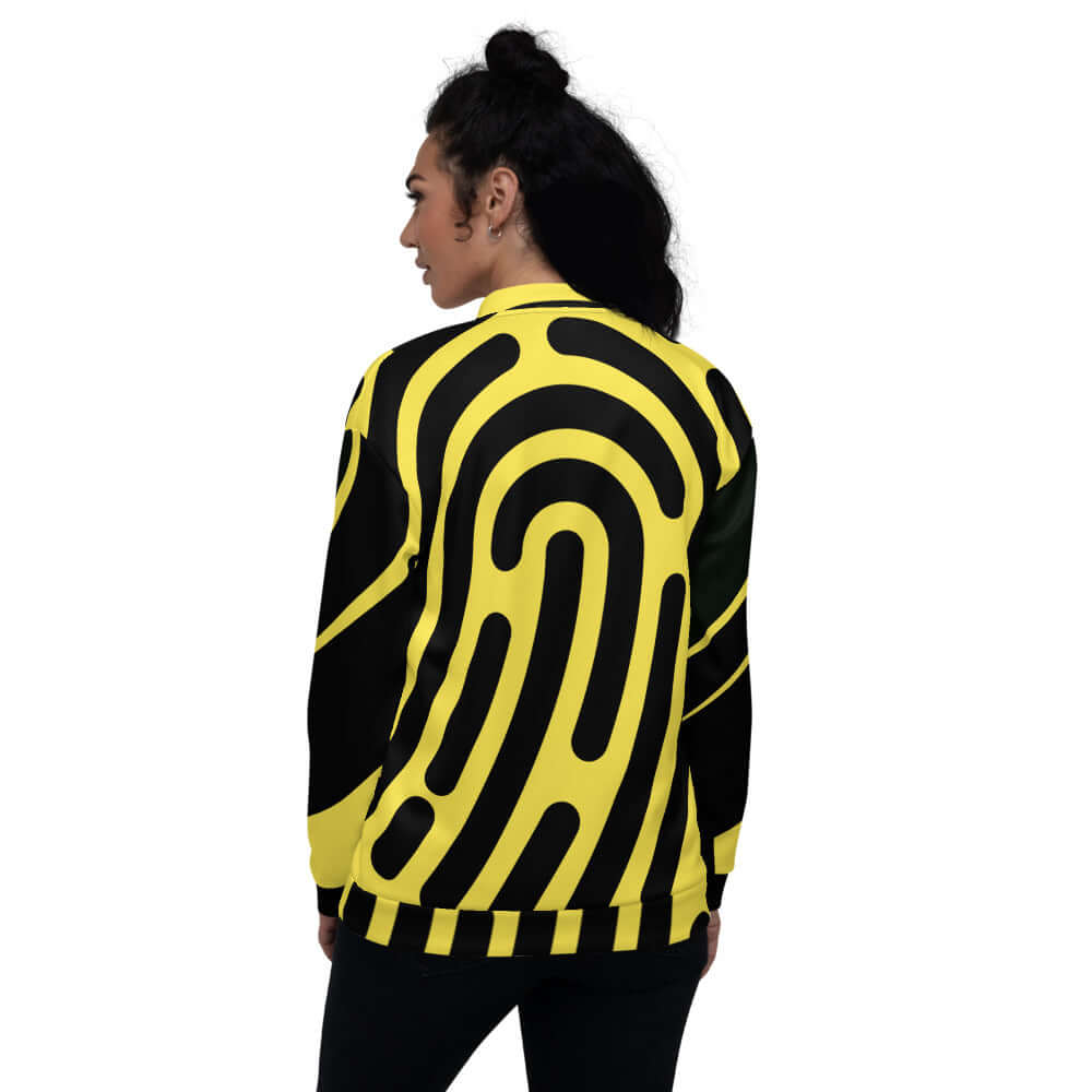 Back view of a model wearing Unisex Bomberjacke N°5 in black and yellow, showcasing its unique all-over design and comfortable fit.