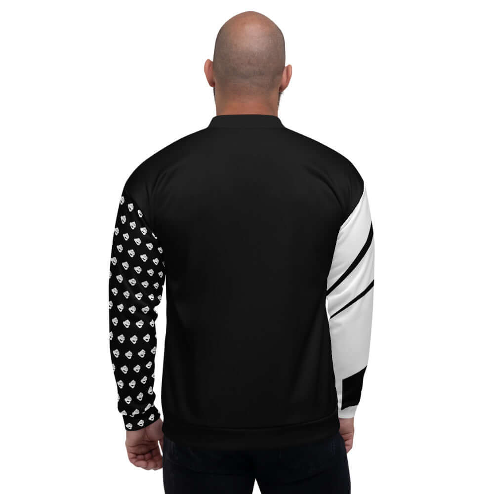 Unisex Bomberjacke N°7 in black and white design, worn by model, showing back view and patterned sleeves.