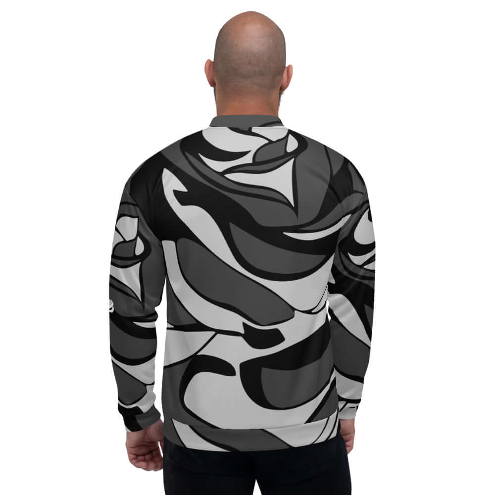 Unisex Bomberjacke N°10 in abstract black and white design, back view, showcasing loose fit and fleece lining.