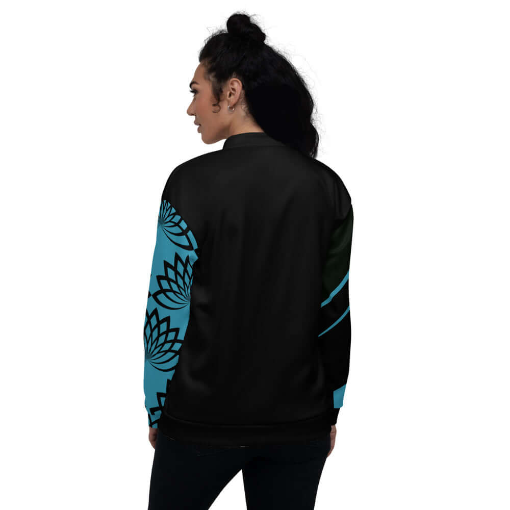 Person wearing Unisex Bomberjacke N°11 with floral sleeve design, showcasing versatile style.