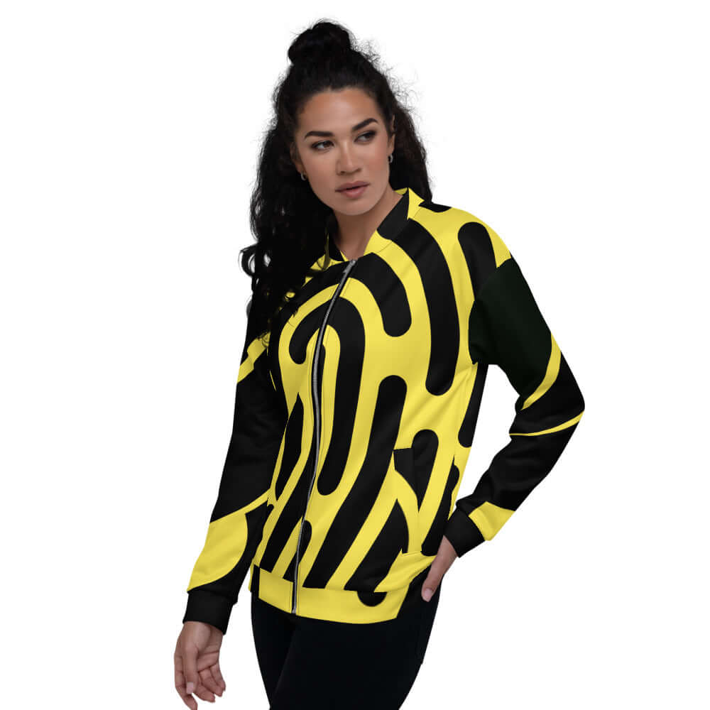 Woman wearing Unisex Bomberjacke N°5, yellow and black abstract design, stylish unisex fit, enhances any look.