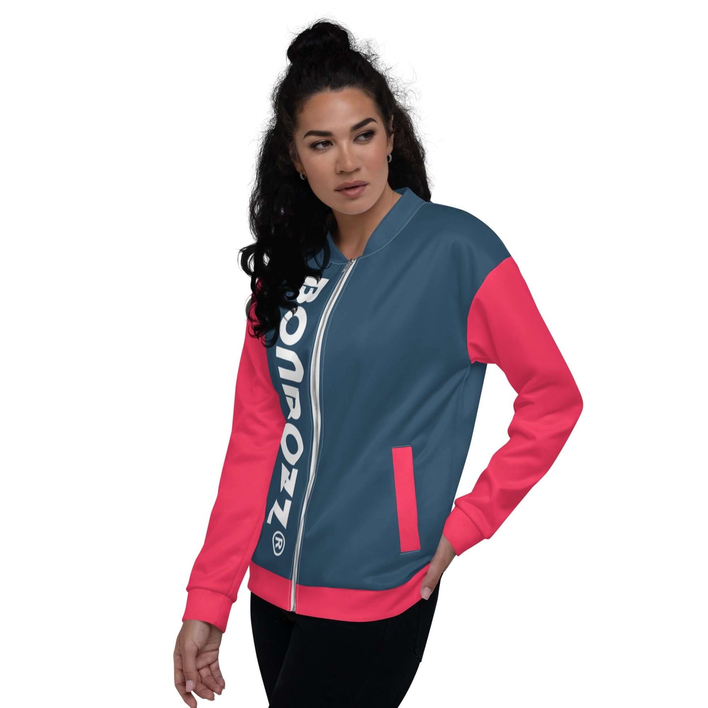 Woman wearing Unisex Bomberjacke N°34 with blue and pink design, showcasing relaxed unisex fit.