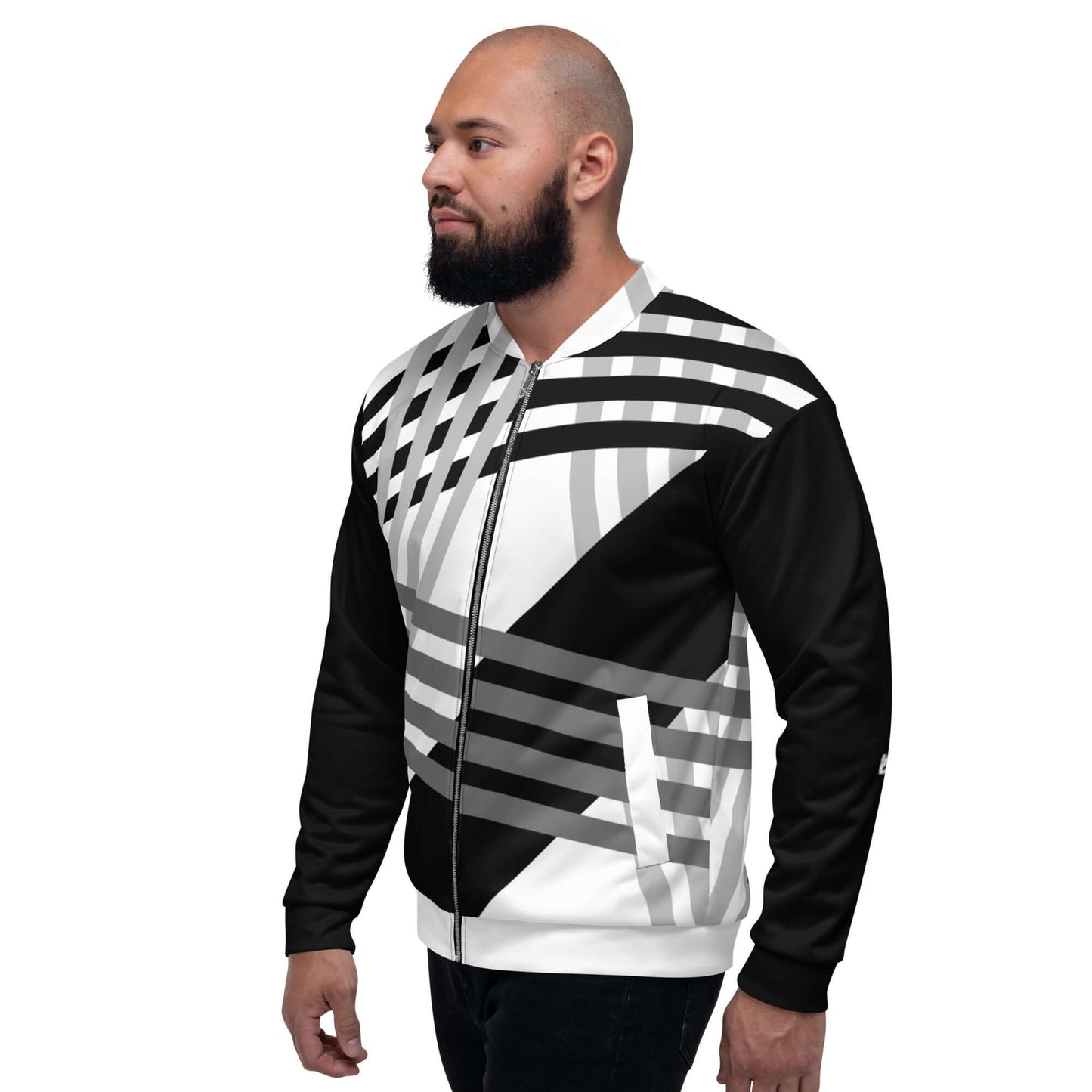 Model wearing Unisex Bomberjacke N°37 with black and white geometric design, side view.