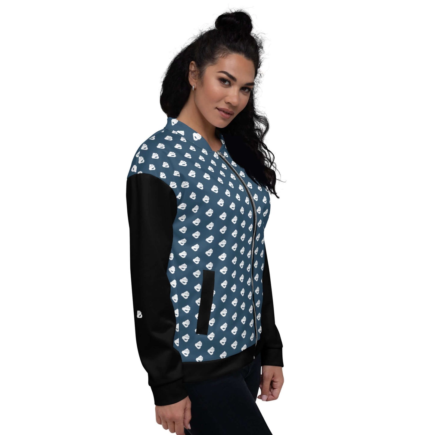 Model wearing Unisex Bomberjacke N°36 with blue patterned fabric and black sleeves.