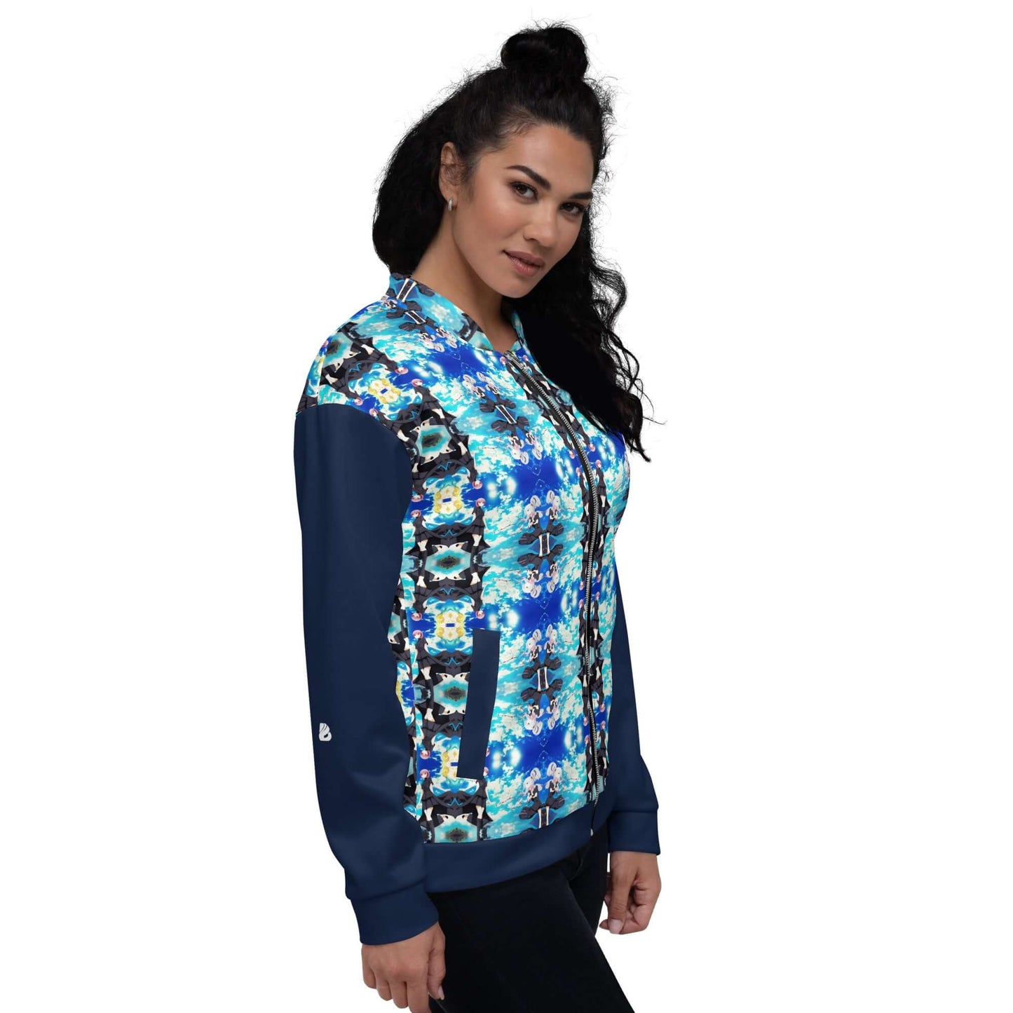 Model wearing Unisex Bomberjacke N°40 with vibrant blue pattern and fleece lining, perfect for casual and layered outfits.