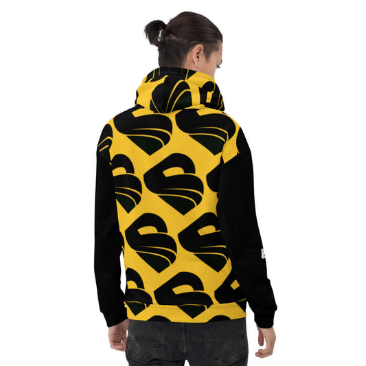 Person wearing Unisex-Kapuzenpullover N°30 with bold yellow and black print, showing the comfortable and stylish design.