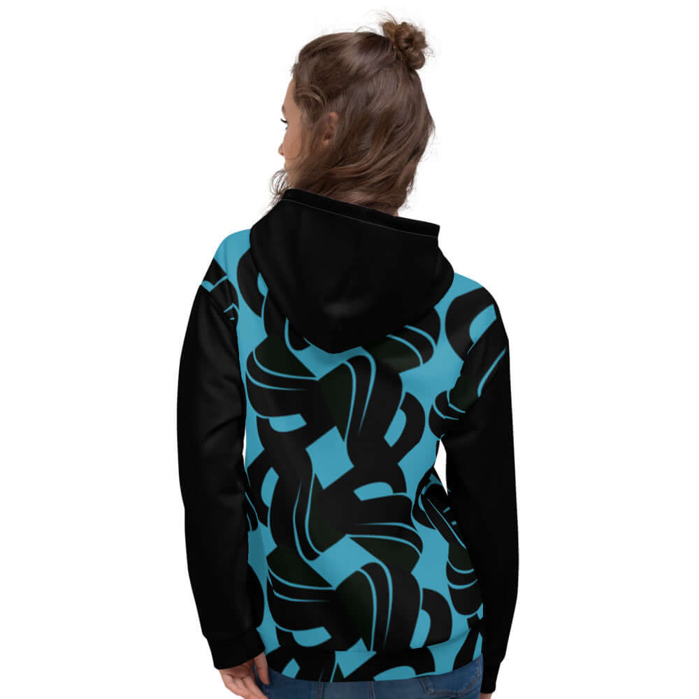 Person wearing Unisex-Kapuzenpullover N°32 with vibrant pattern, soft fabric, and relaxed fit, ideal for cool evenings.