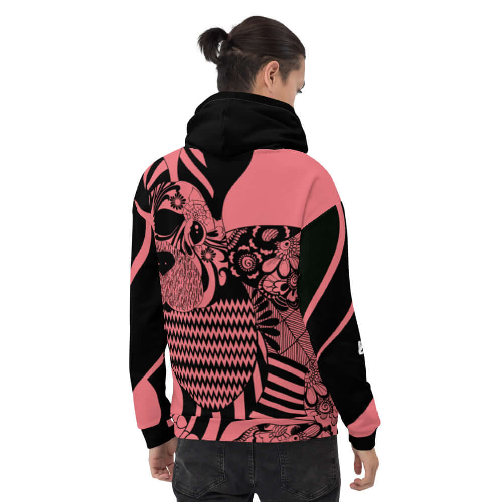 Man wearing colorful Unisex-Kapuzenpullover N°33 with a unique design, showcasing soft exterior and brushed fleece interior for comfort.