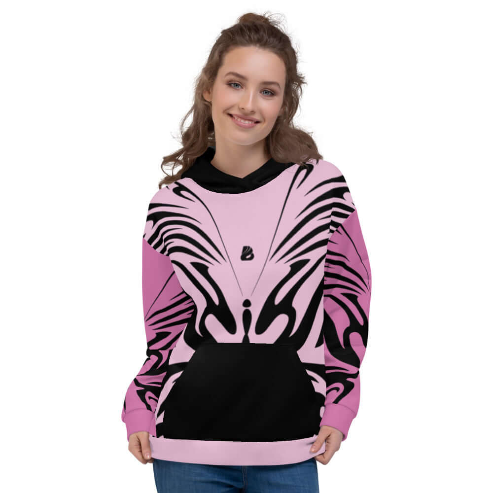 Woman wearing Unisex-Kapuzenpullover N°27 with vibrant butterfly print in soft fabric, showcasing both comfort and style.