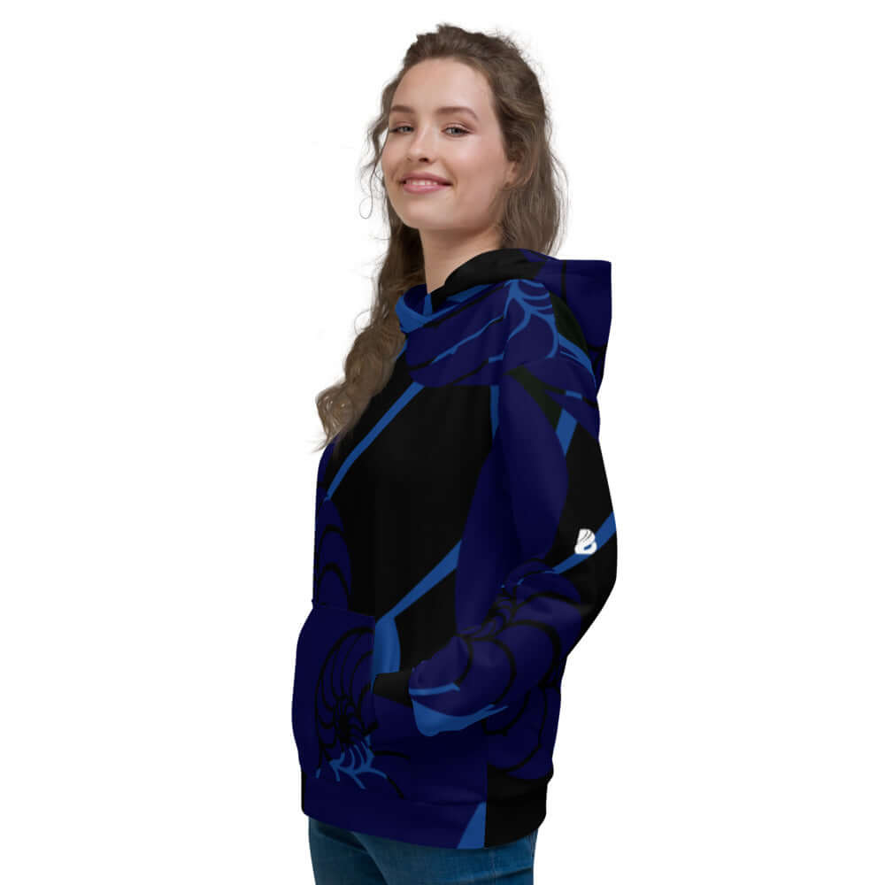 Woman wearing a stylish Unisex-Kapuzenpullover with vibrant blue design, perfect for cozy evenings.