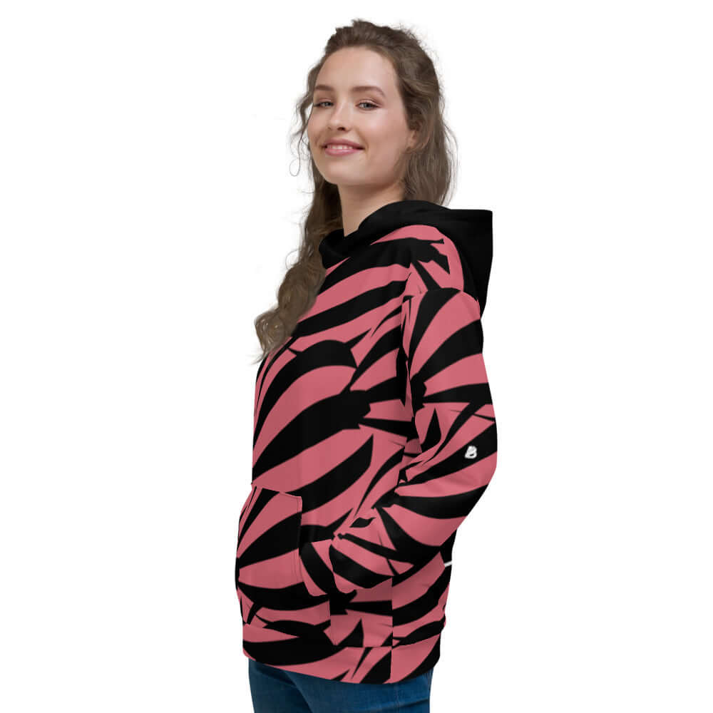 Unisex-Kapuzenpullover N°17 in vibrant pink and black print, cozy brushed fleece interior, perfect for cool evenings.