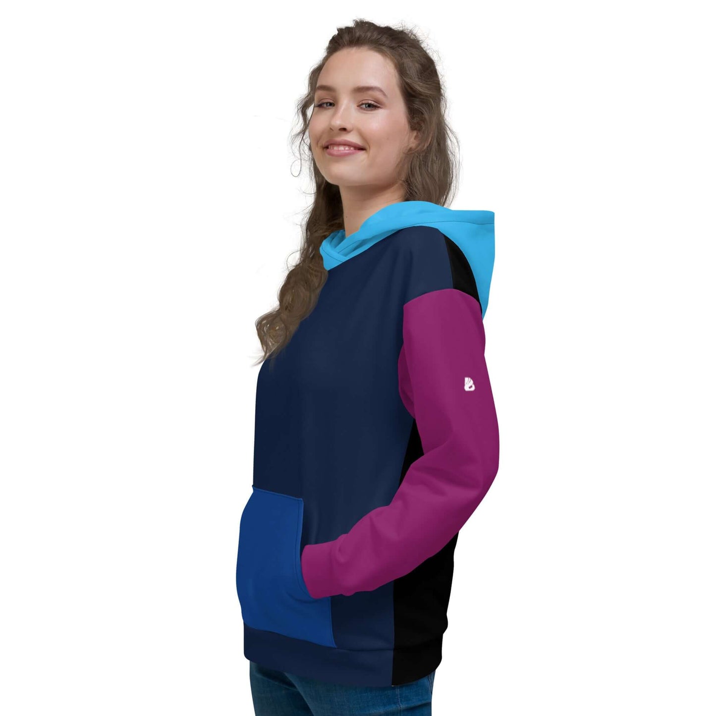 Person wearing Unisex-Kapuzenpullover N°43 with colorful design and soft fabric, showing side view of hooded sweatshirt.