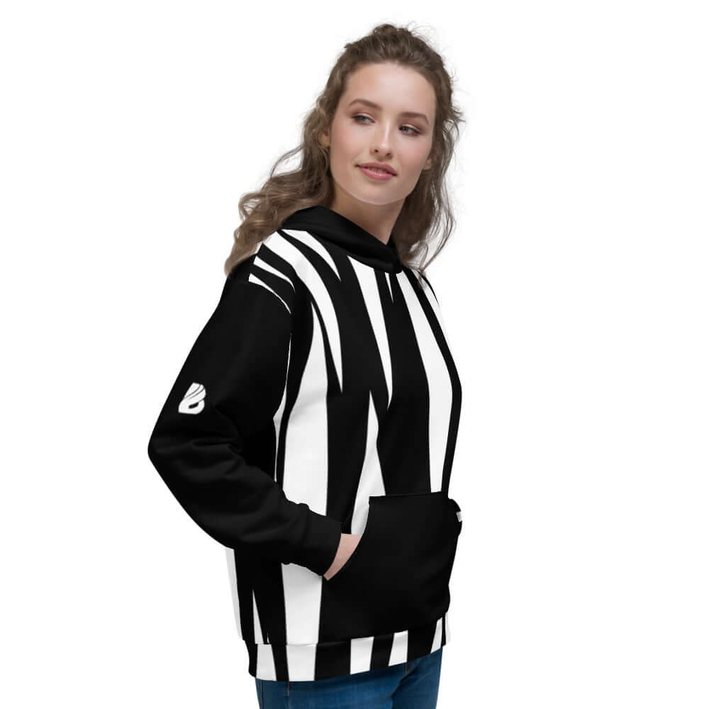 Woman wearing Unisex-Kapuzenpullover N°4 with black and white pattern, showing comfort and style.