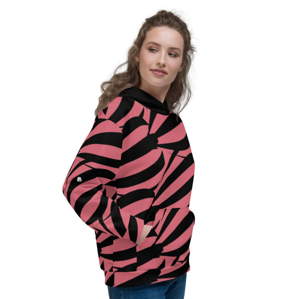 Woman wearing pink and black Unisex-Kapuzenpullover N°17 with abstract pattern