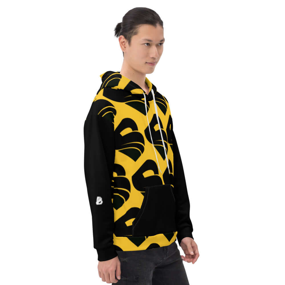 Model wearing Unisex-Kapuzenpullover N°30 with vibrant print and comfortable fit.