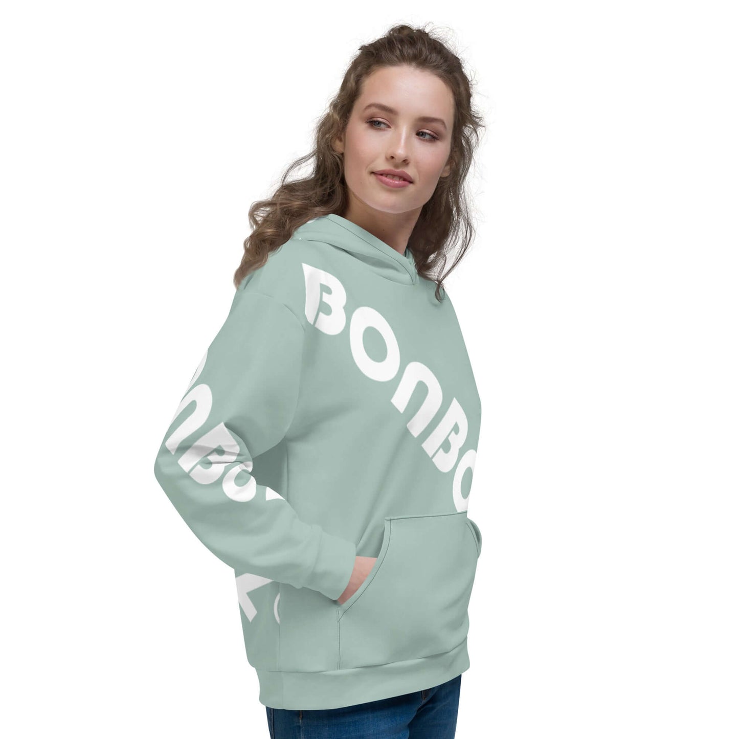 Woman wearing Unisex-Kapuzenpullover N°41 in light green with bold white print, side profile.