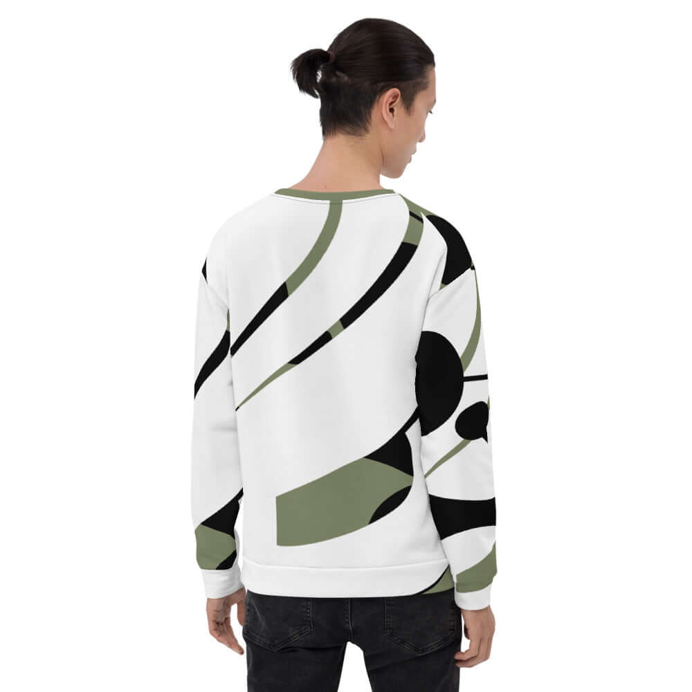 Model wearing Unisex-Pullover N°3 with unique all-over print, black and green abstract design, showcasing hand-sewn quality.