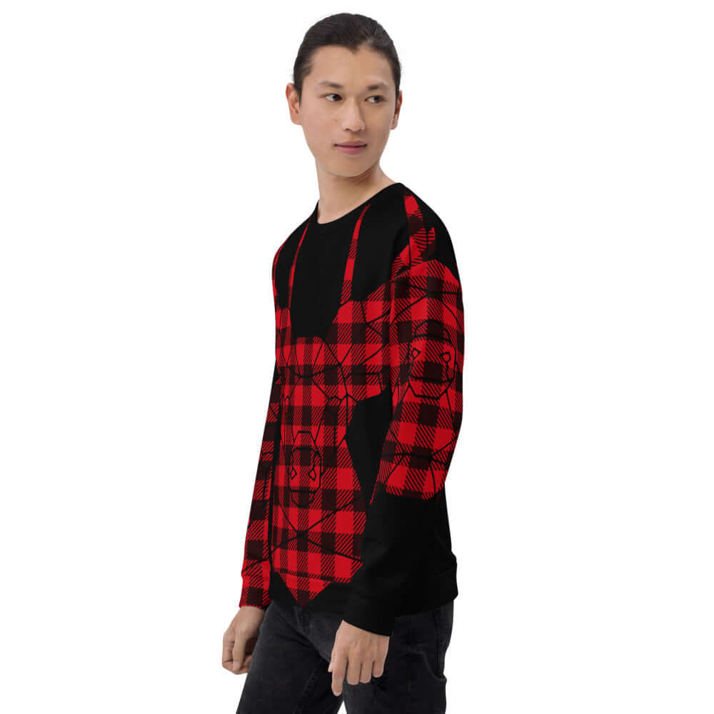 Model wearing Unisex-Pullover N°7 with red and black checkered design, featuring comfortable cotton-feel material and soft brushed fleece.