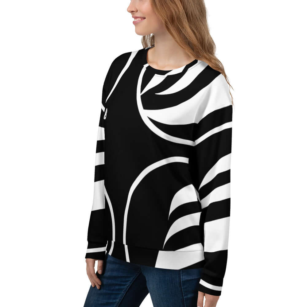 Woman wearing Unisex-Pullover N°9 with intricate black and white abstract design, crafted from soft, durable polyester and cotton blend.