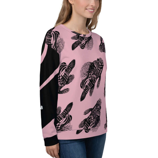 Model wearing Unisex-Pullover N°12 with intricate all-over print in pink and black, showcasing soft brushed fleece and precise hand-sewn finish.