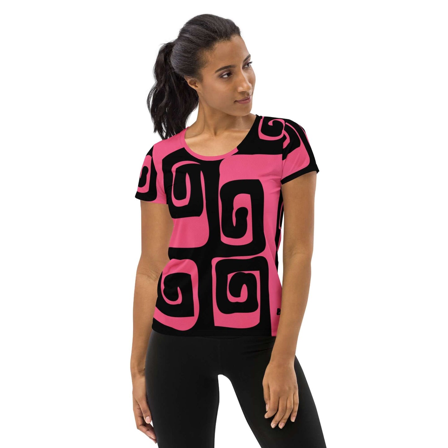 Woman wearing Allover-Sport-T-Shirt für Damen N°4 with pink and black geometric design, ideal for sports with moisture-wicking fabric.