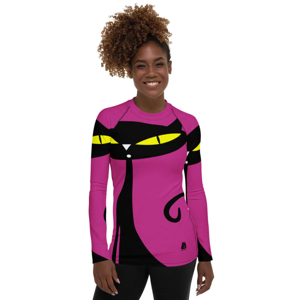 Damen-Rash-Guard N°1 with colorful cat design worn by a woman, showing long sleeves and a form-fitting style for sports protection.