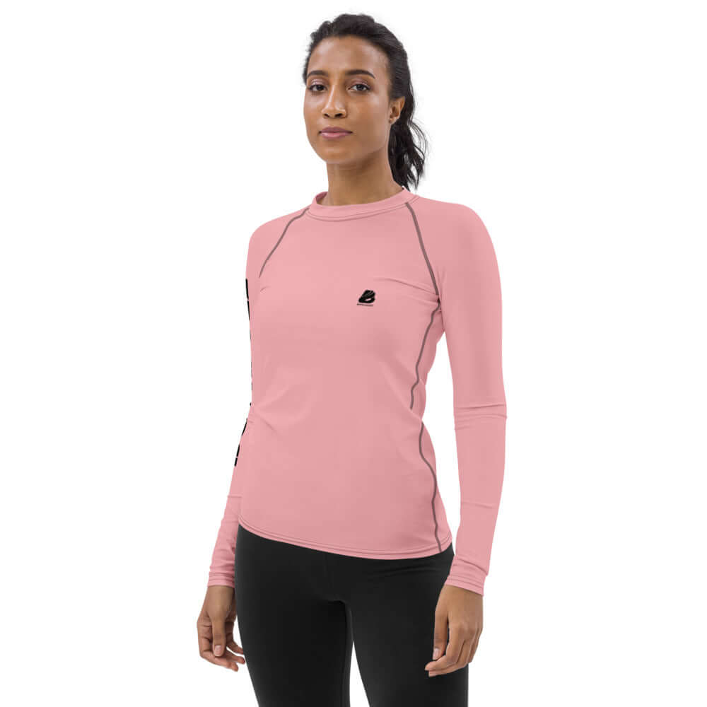 Woman wearing Damen-Rash-Guard N°3 in pink, ideal for sports, provides UV protection and comfort with ergonomic seams and 4-way stretch fabric.